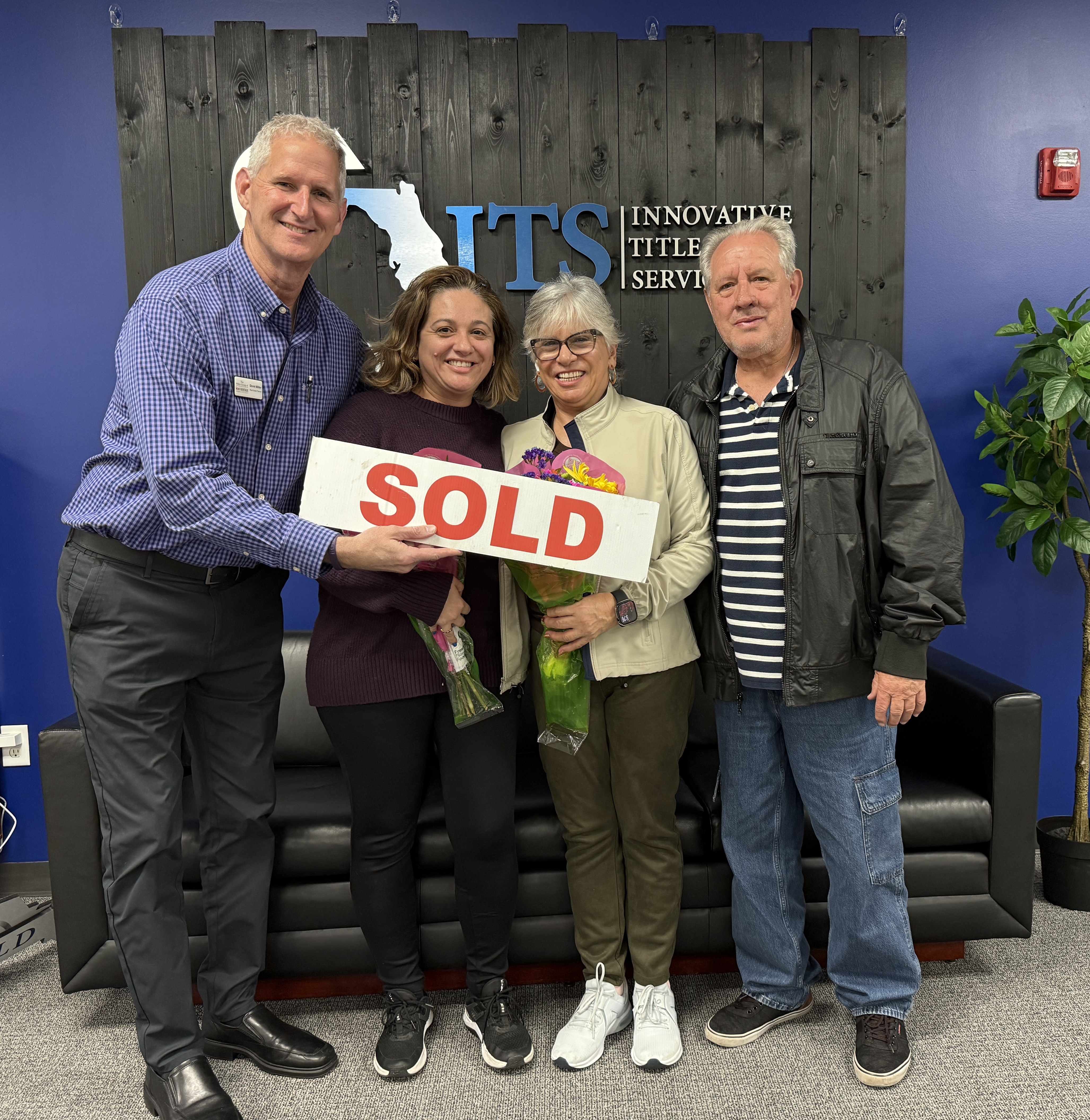 The Caetano family celebrating after selling their home and purchasing a larger home with The Miller Group