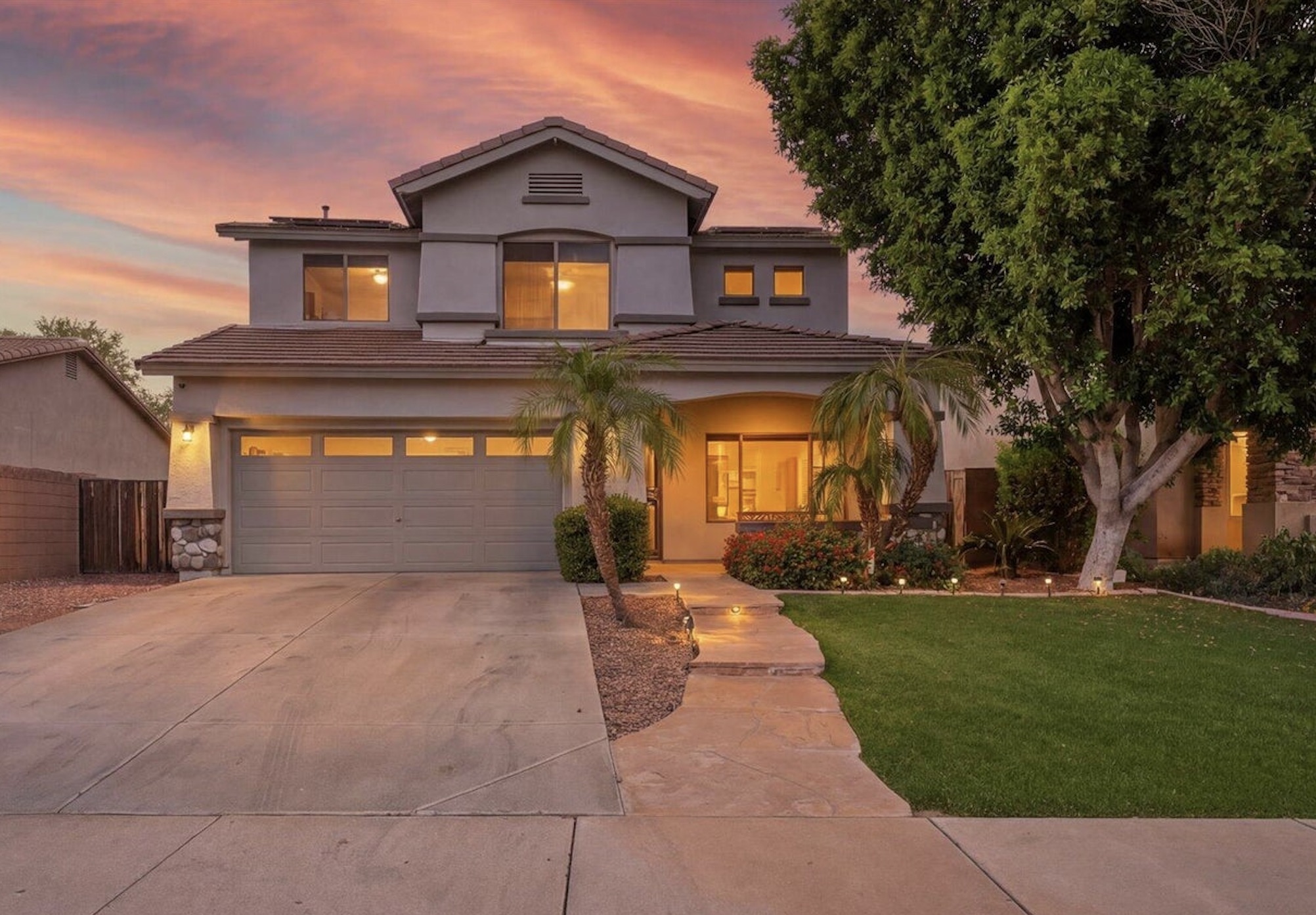 Two-story stucco home at sunset in Surprise Arizona