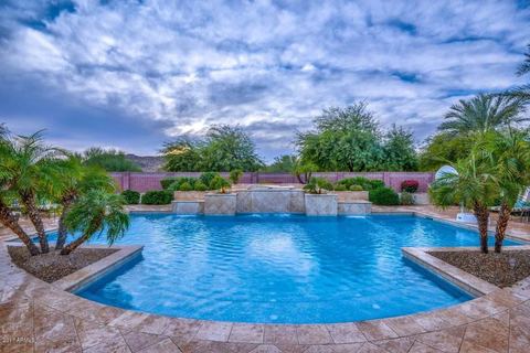 Backyard swimming pool with water features and space for outdoor relaxation