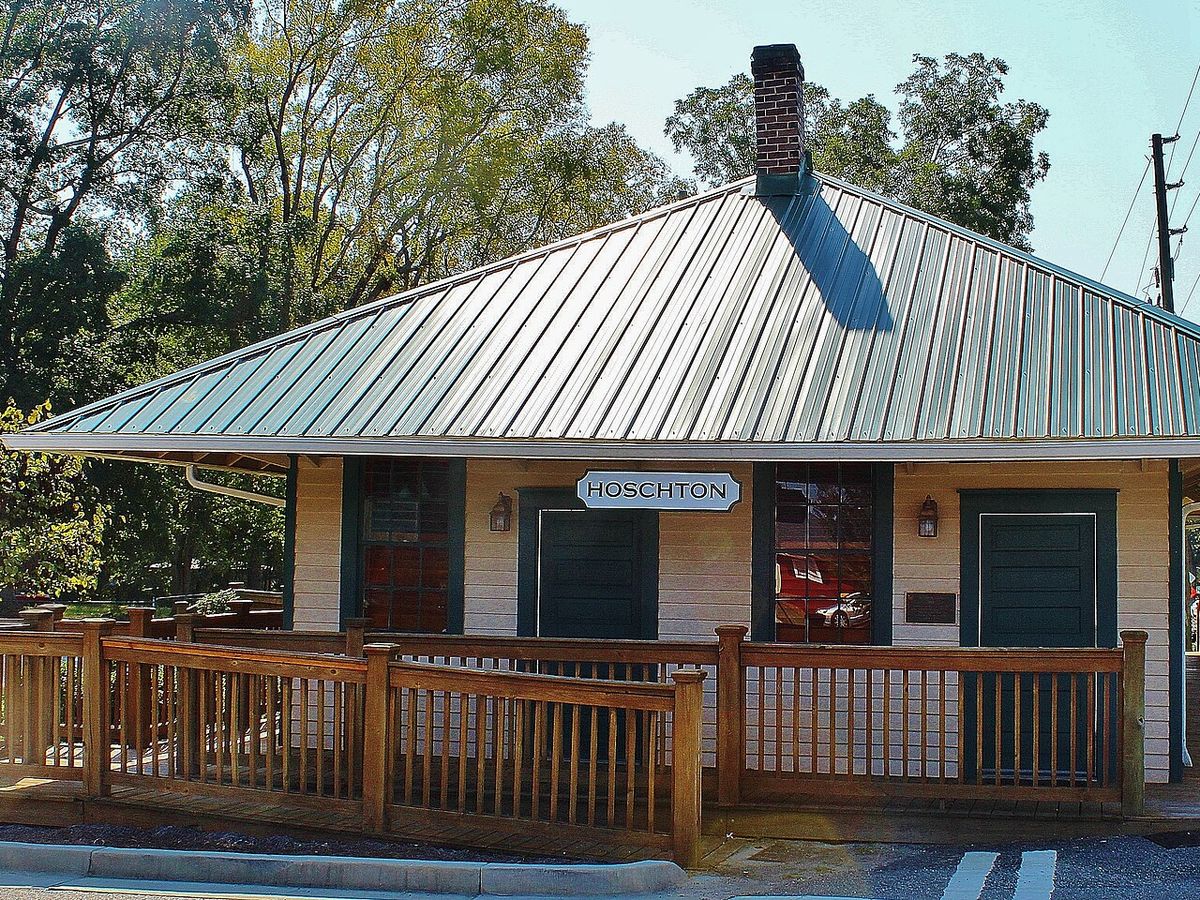 The restored Hoschton Depot with its green metal roof in Hoschton, Georgia