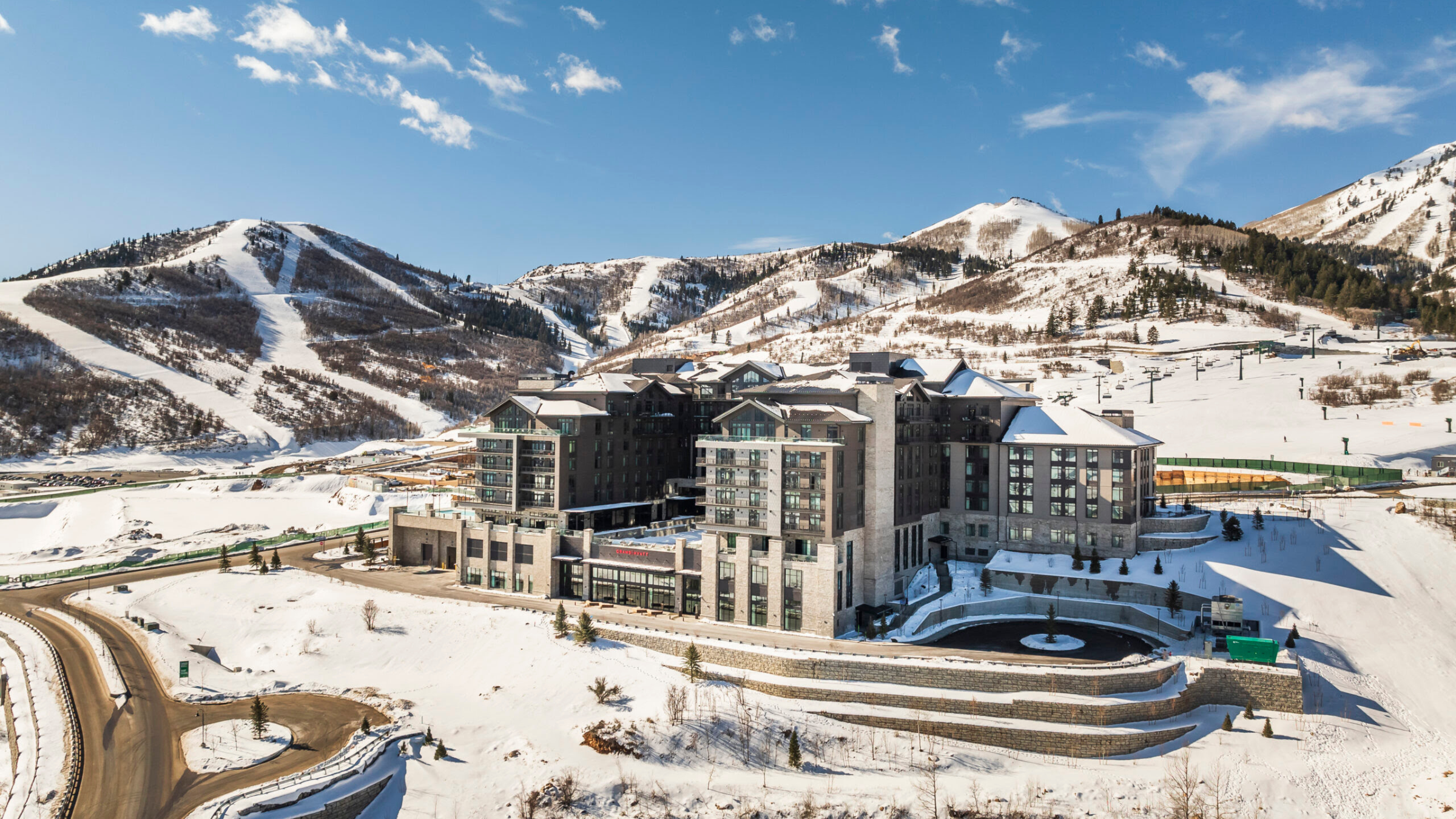 Aerial view of Deer Valley® East Village showing new construction, ski slopes, and luxury resort facilities