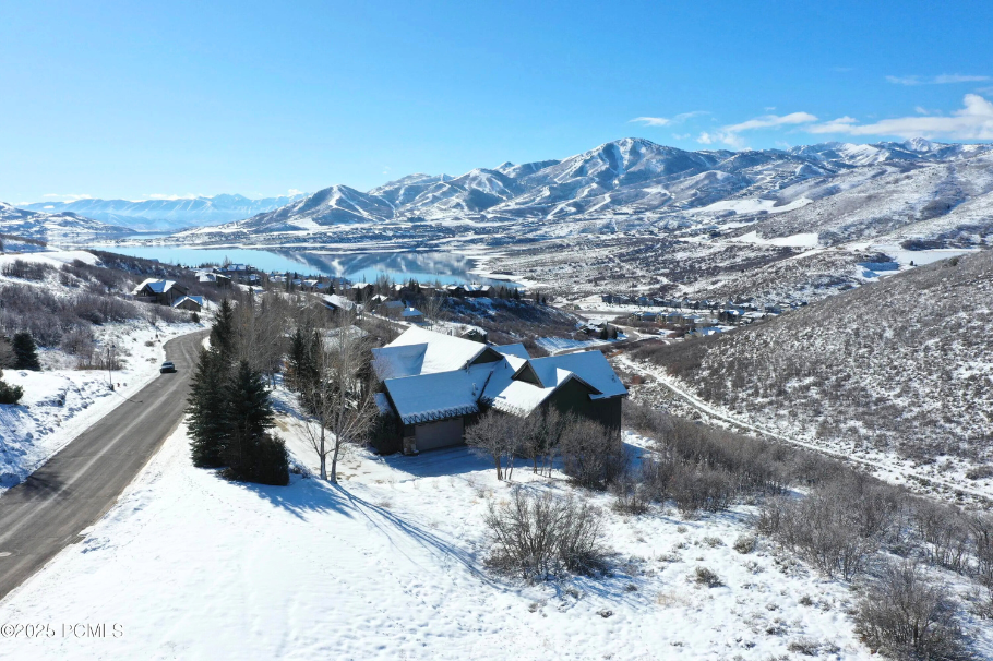 Snow-covered Deer Mountain homes with Jordanelle Reservoir and mountain views.