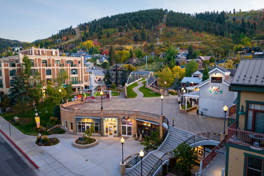 Scenic view of Old Town Park City with mountain backdrop, historic buildings, and a charming pedestrian walkway.