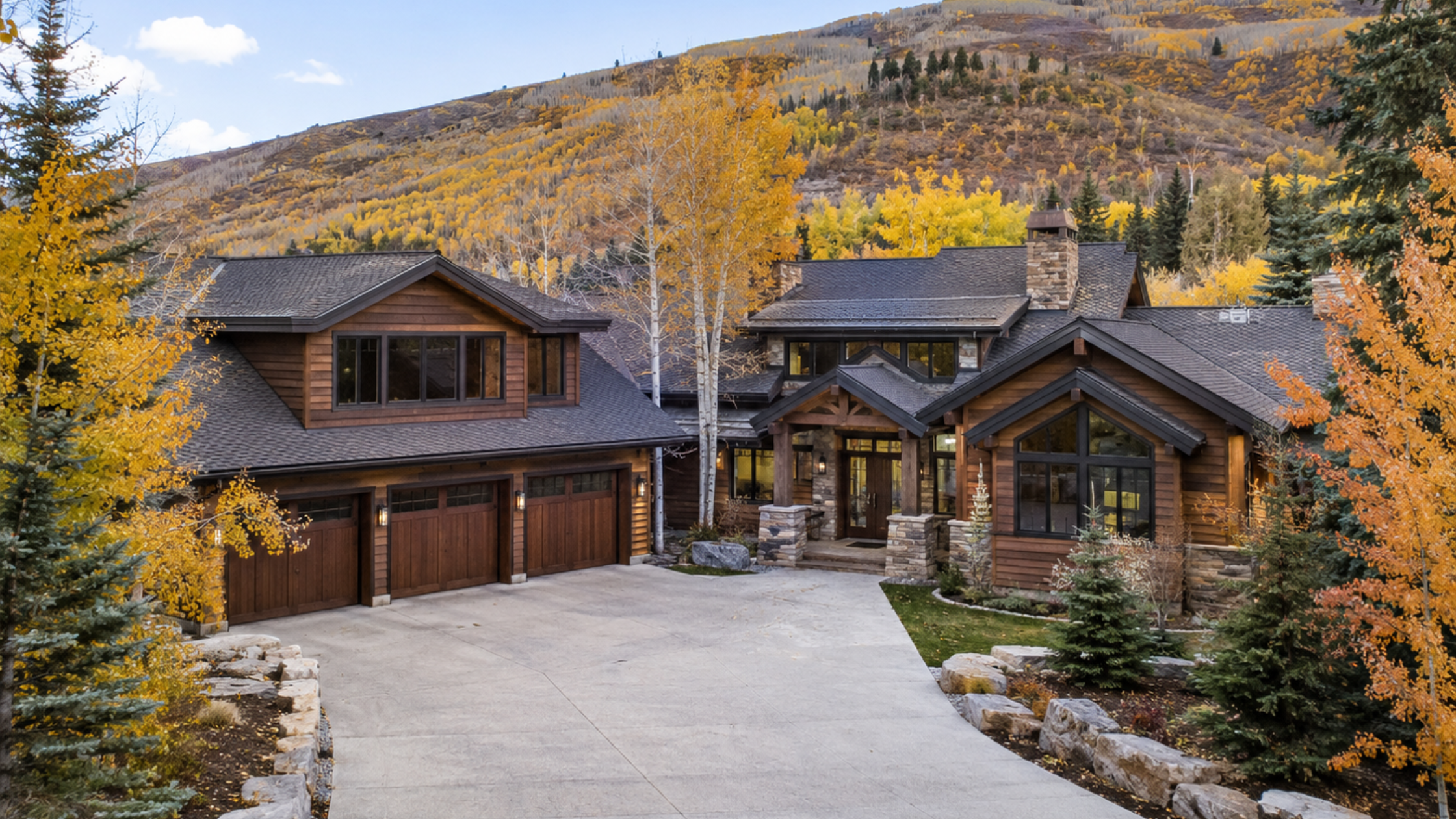 Park City home during a fall property tour with driveway and exterior fully visible