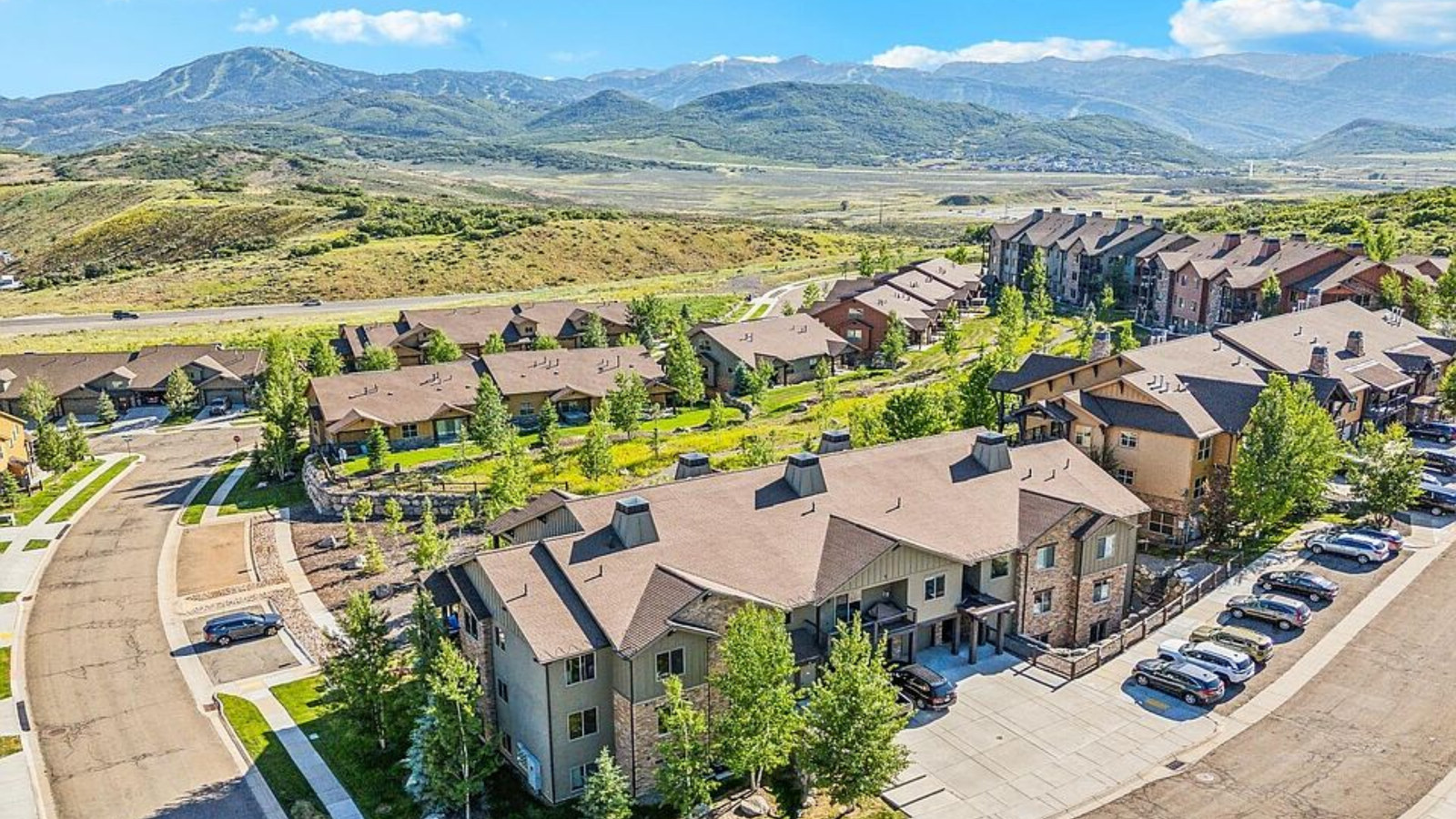 Scenic view of Kamas and Marion Valley with open fields, ranch homes, and the Uinta Mountains in the background.