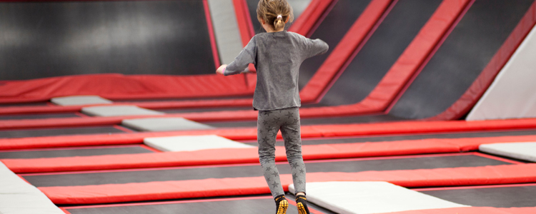 Girl Having Fun At Trampoline Park