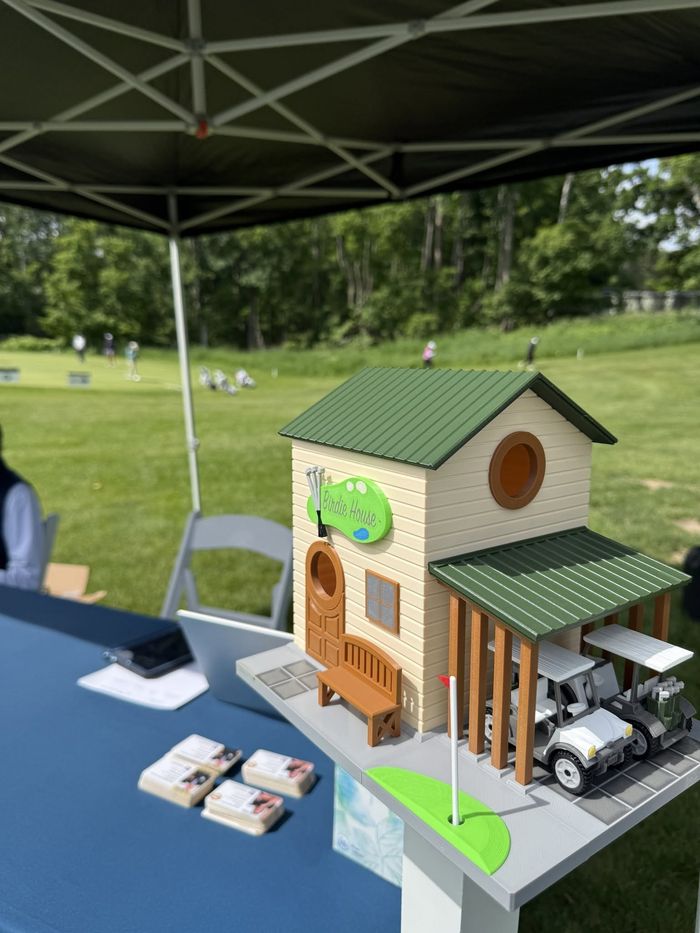 The Hartwick birdhouse on the tent table