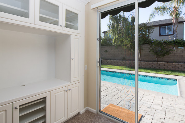5581 Quinn St-Entertainment Cabinet and Door to Backyard Pool Area