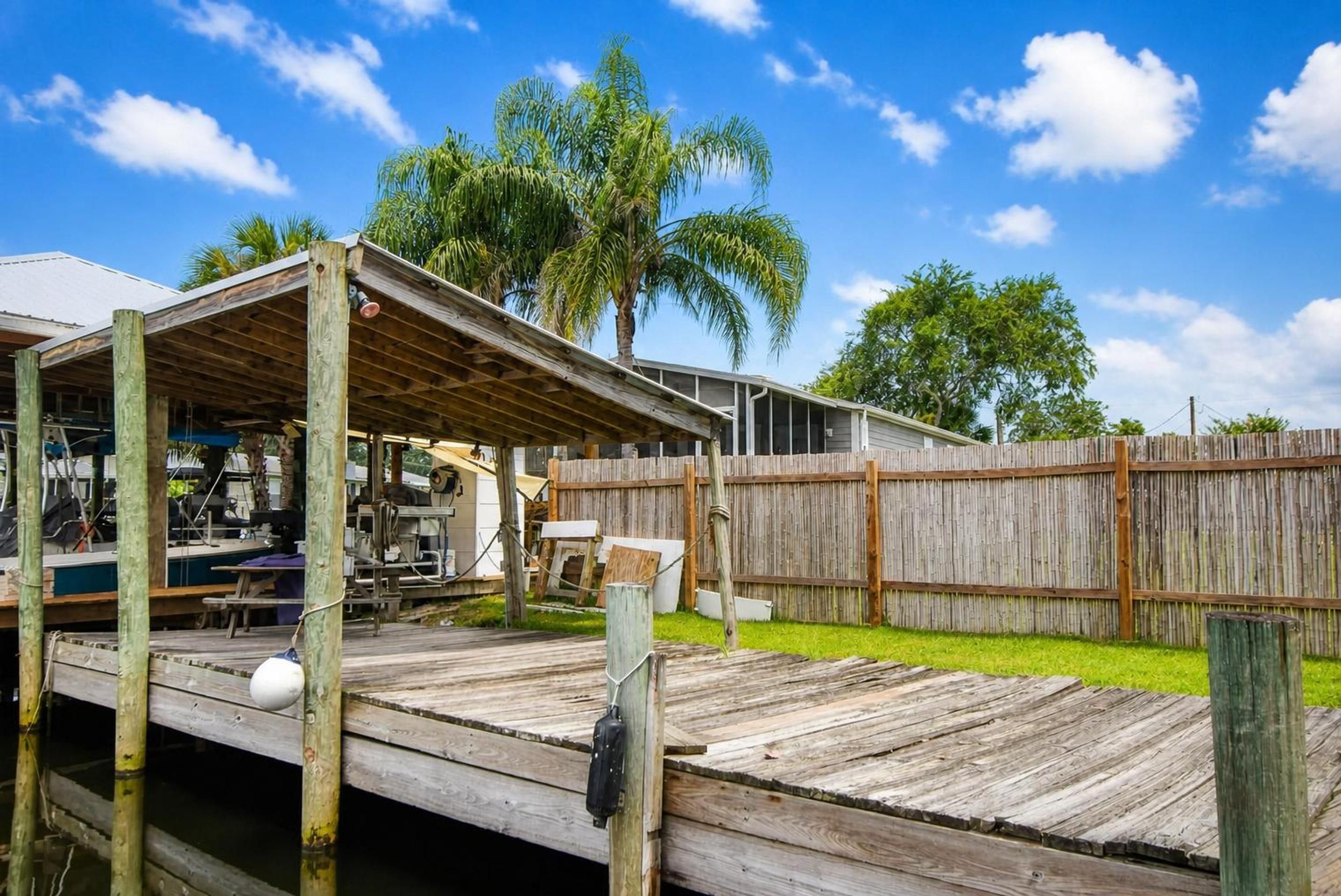 Covered dock and canal at 25 Scott Street in Welaka