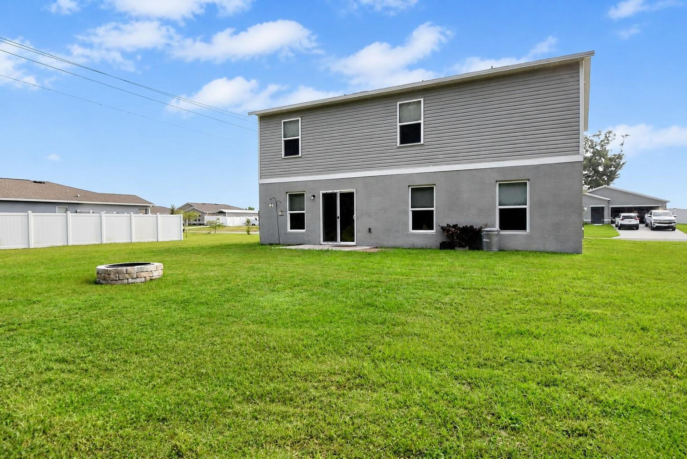 Rear exterior and backyard at 205 River Hill Drive