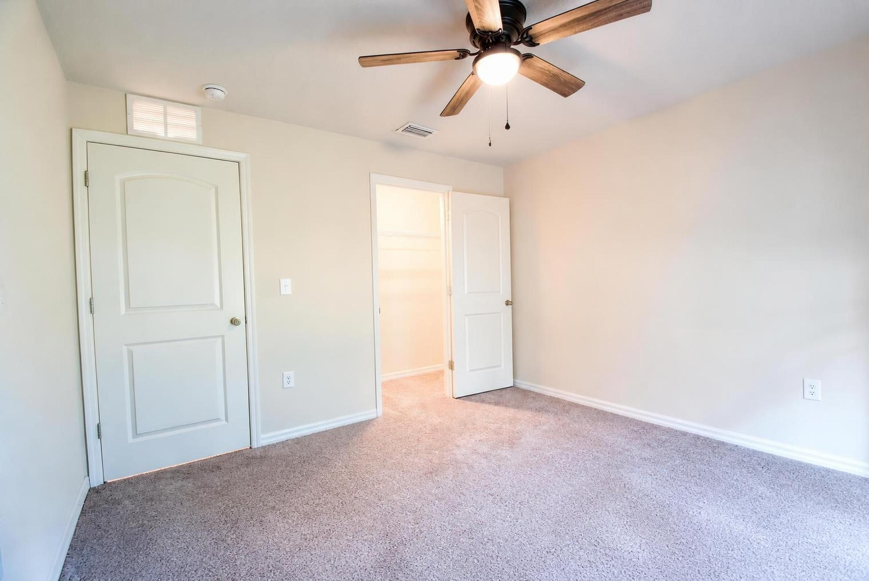 First-story bedroom at 205 River Hill Drive