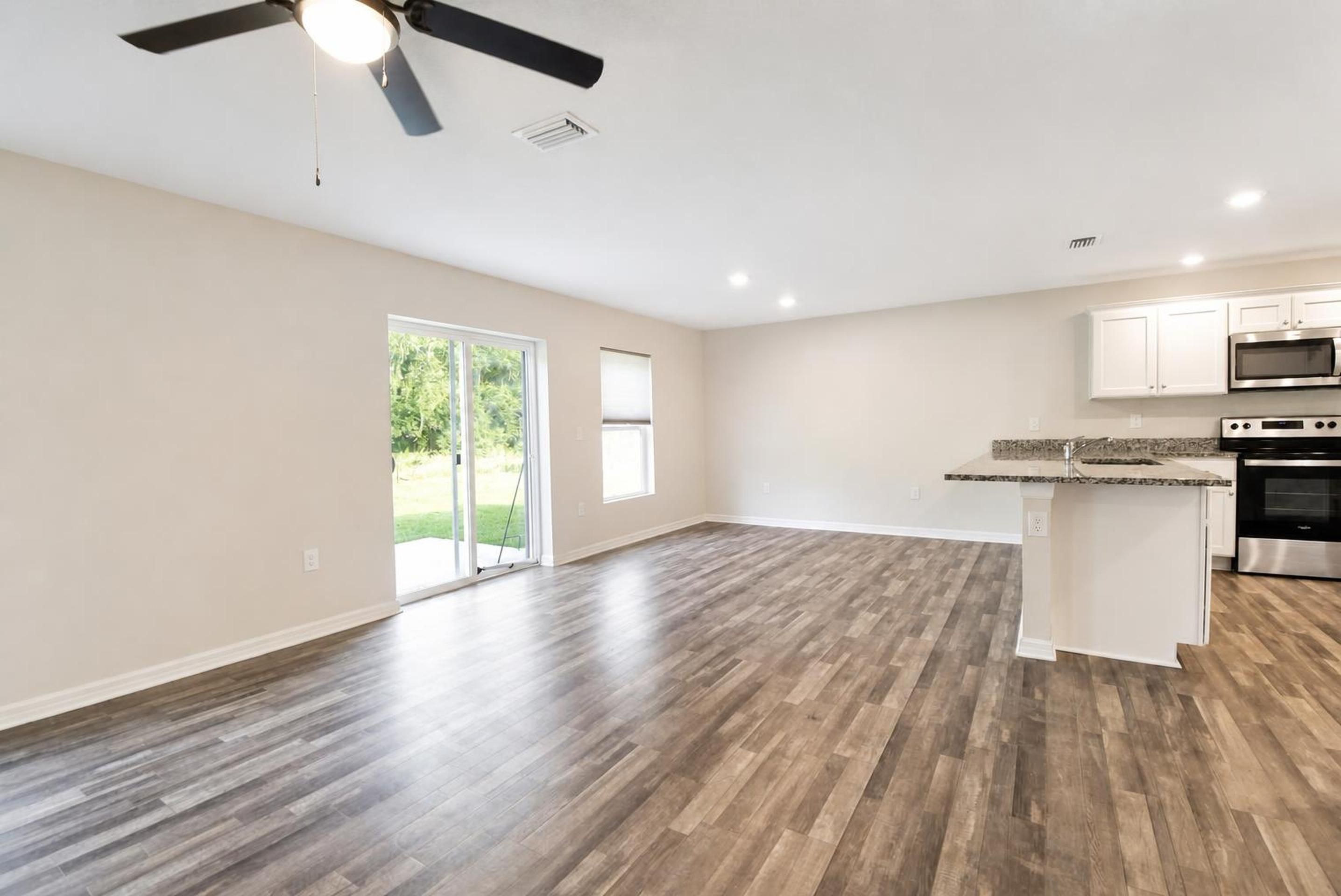 Open living, dining, and kitchen area