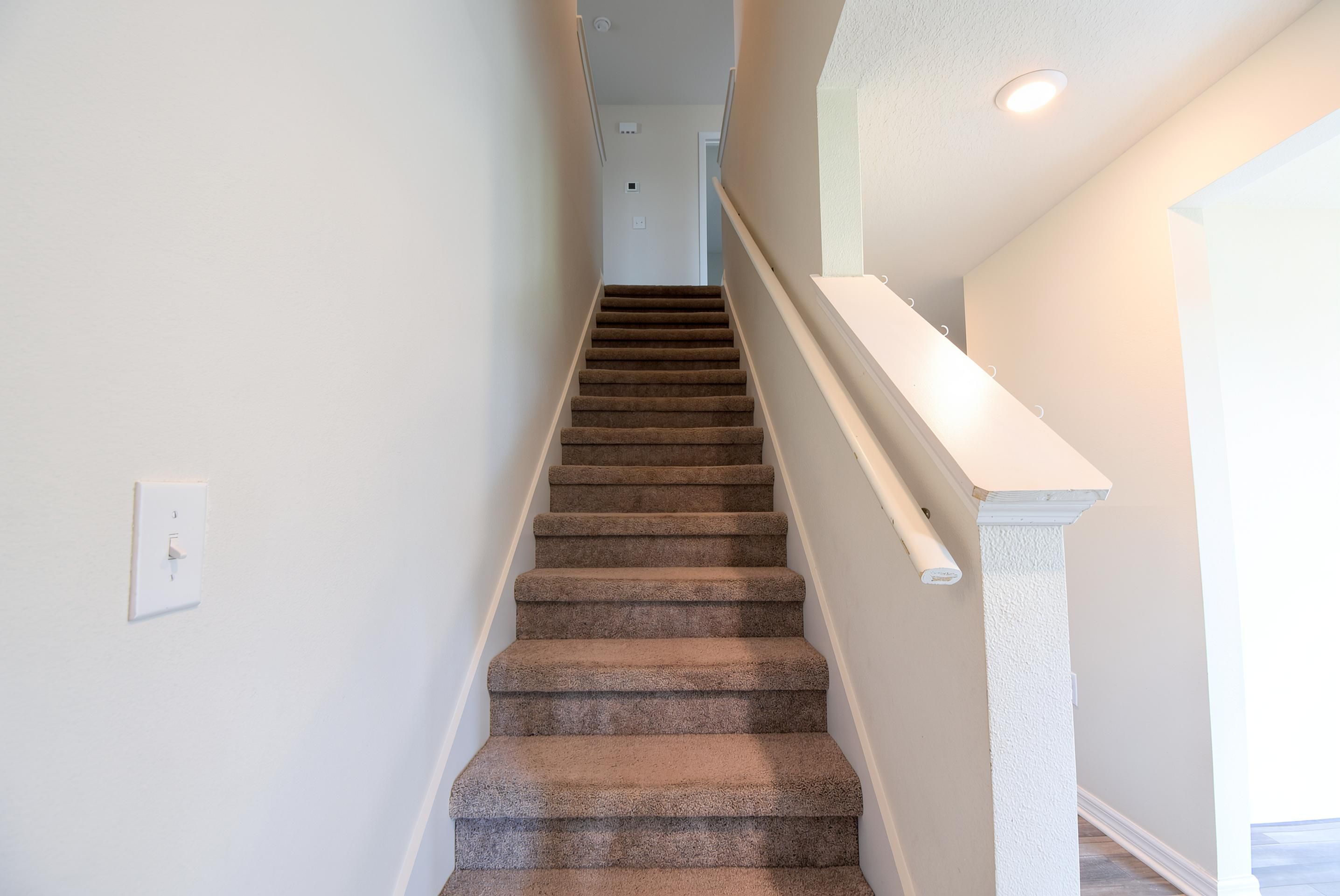 Interior staircase at 205 River Hill Drive