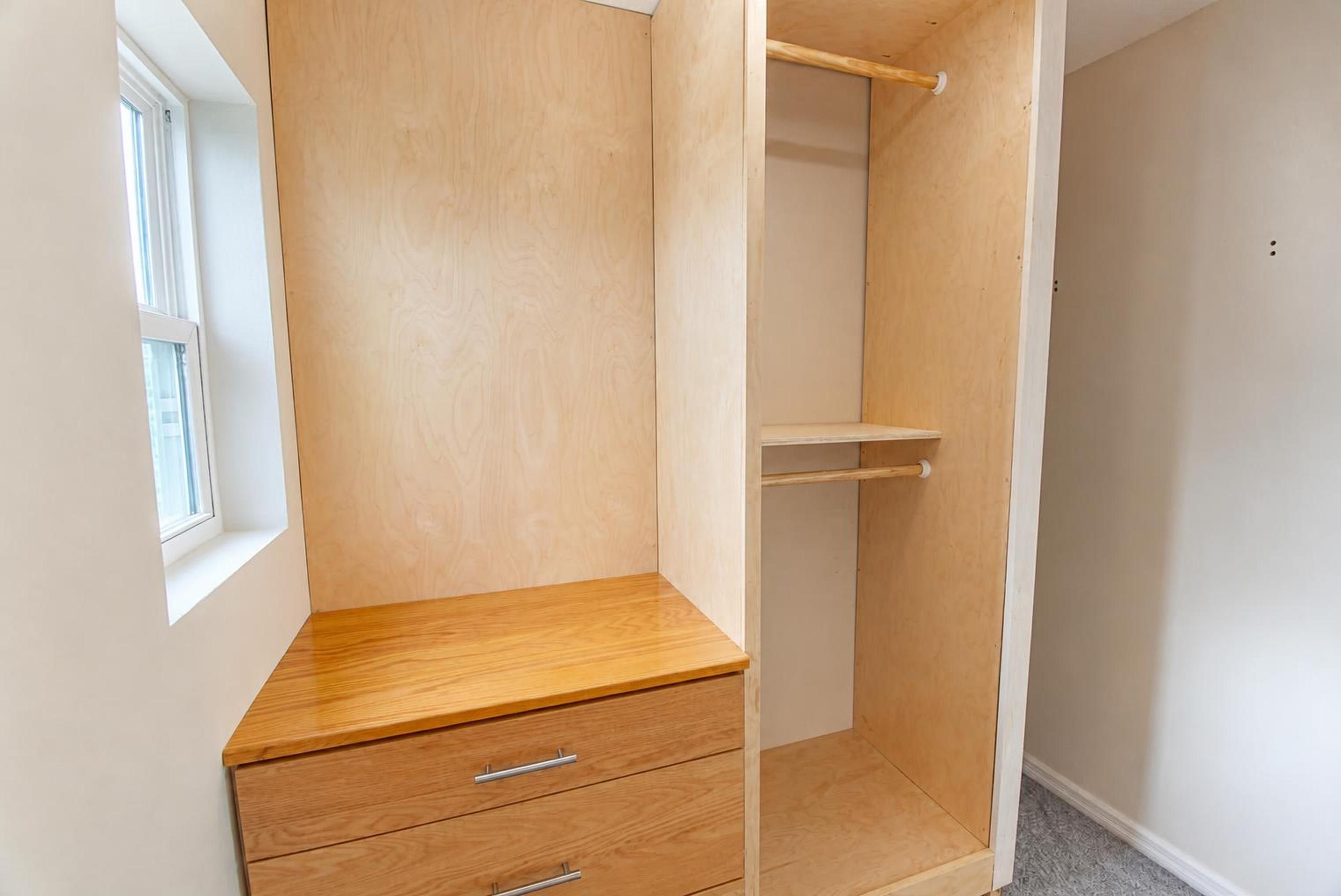 Built-in closet storage in an upstairs bedroom