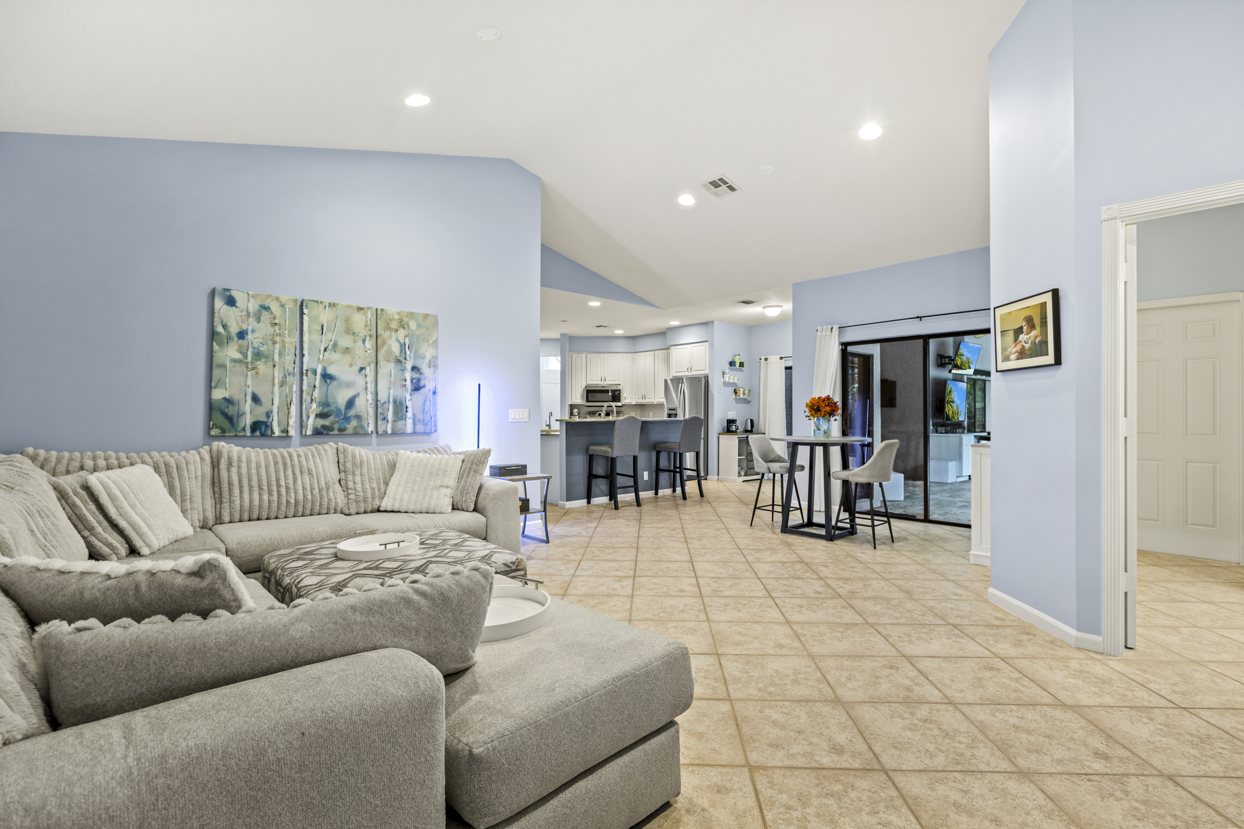 Open living room with vaulted ceilings inside Acreage home in Loxahatchee Florida