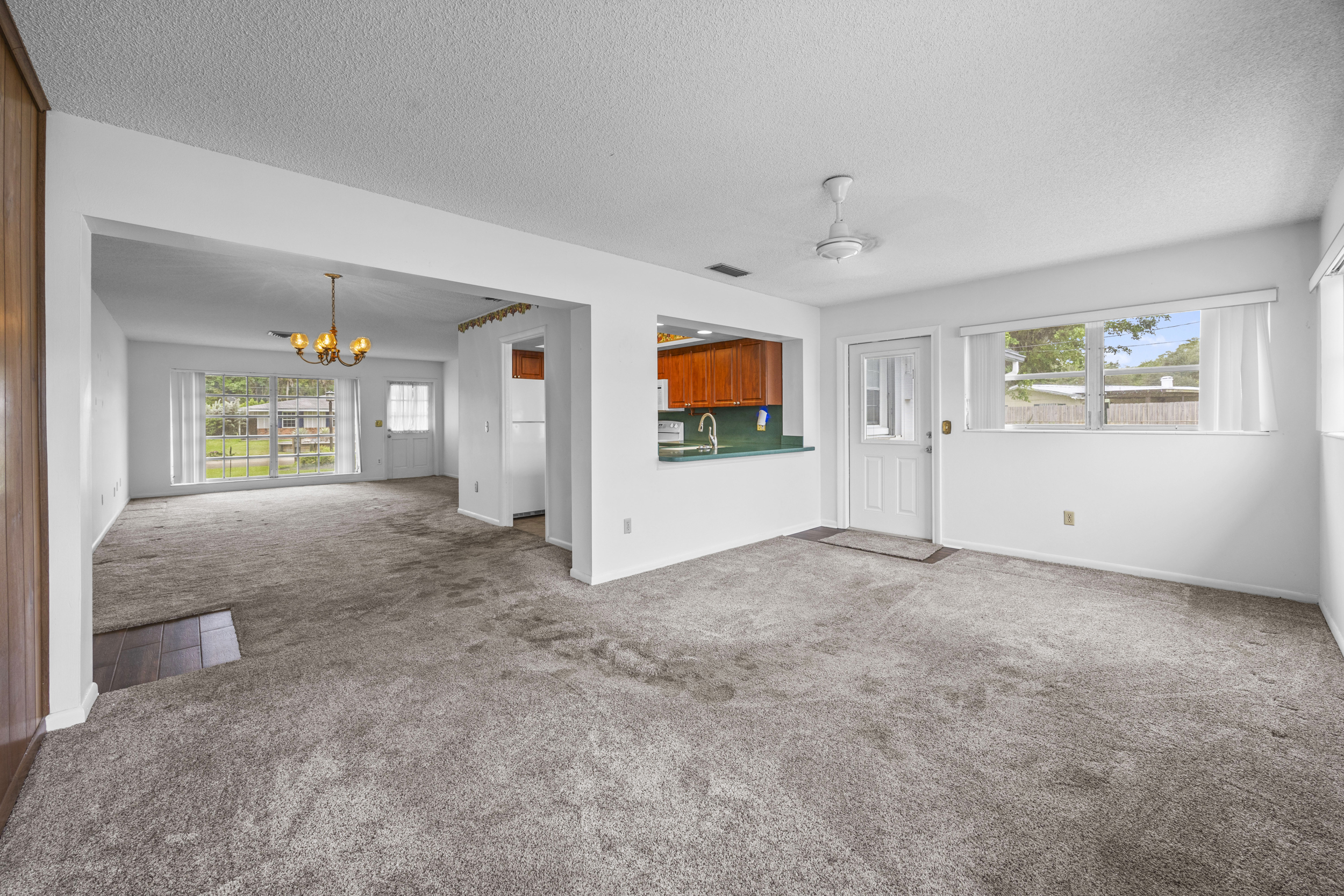 Large fenced backyard at West Palm Beach no-HOA home with room for RV or boat parking on nearly one-third acre lot