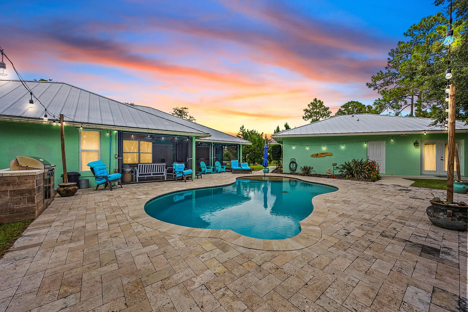 Saltwater pool and pond view on Acreage property in Loxahatchee