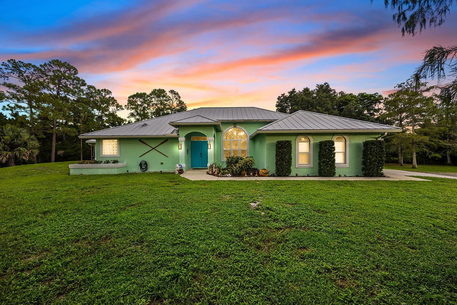 Acreage home with guest house pool and pond in Loxahatchee Florida