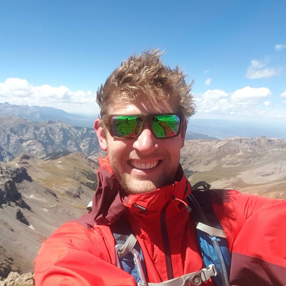John Mace, Durango realtor, on a summit in the San Juan Mountains