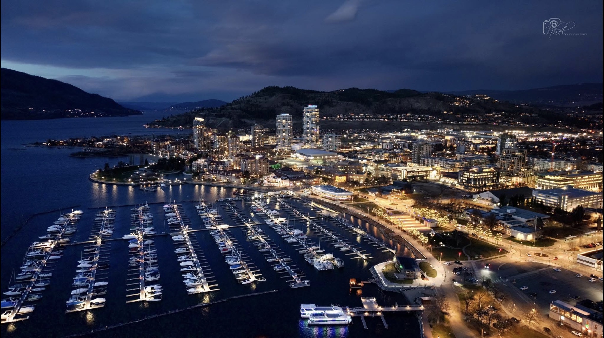 Kelowna marina at night reflecting on Okanagan Lake, spring 2026