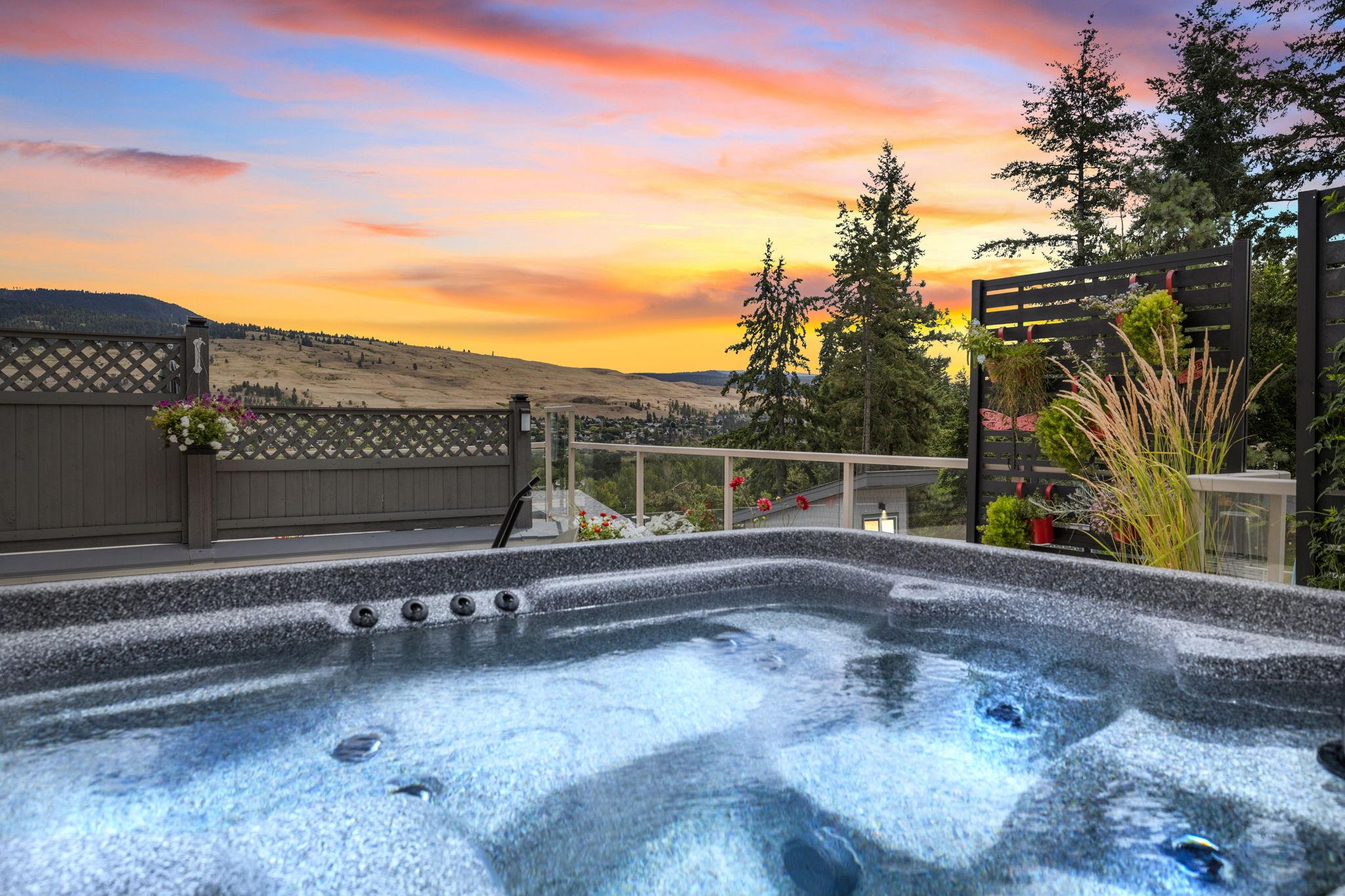Rooftop hot tub with Okanagan Lake sunset view in Lake Country BC, Central Okanagan leasehold and freehold real estate