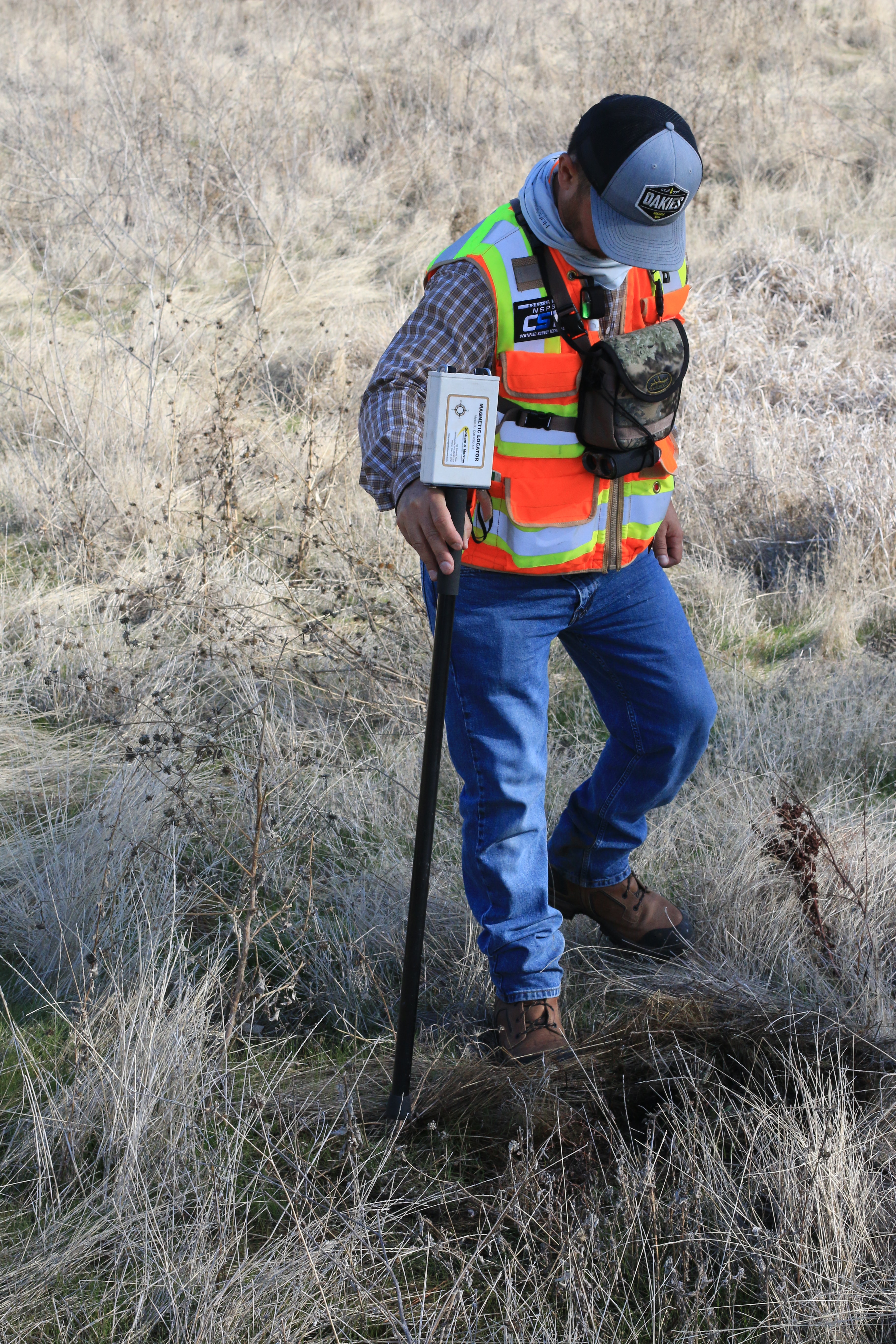 Surveyor surveying vacant land for sale in Colorado